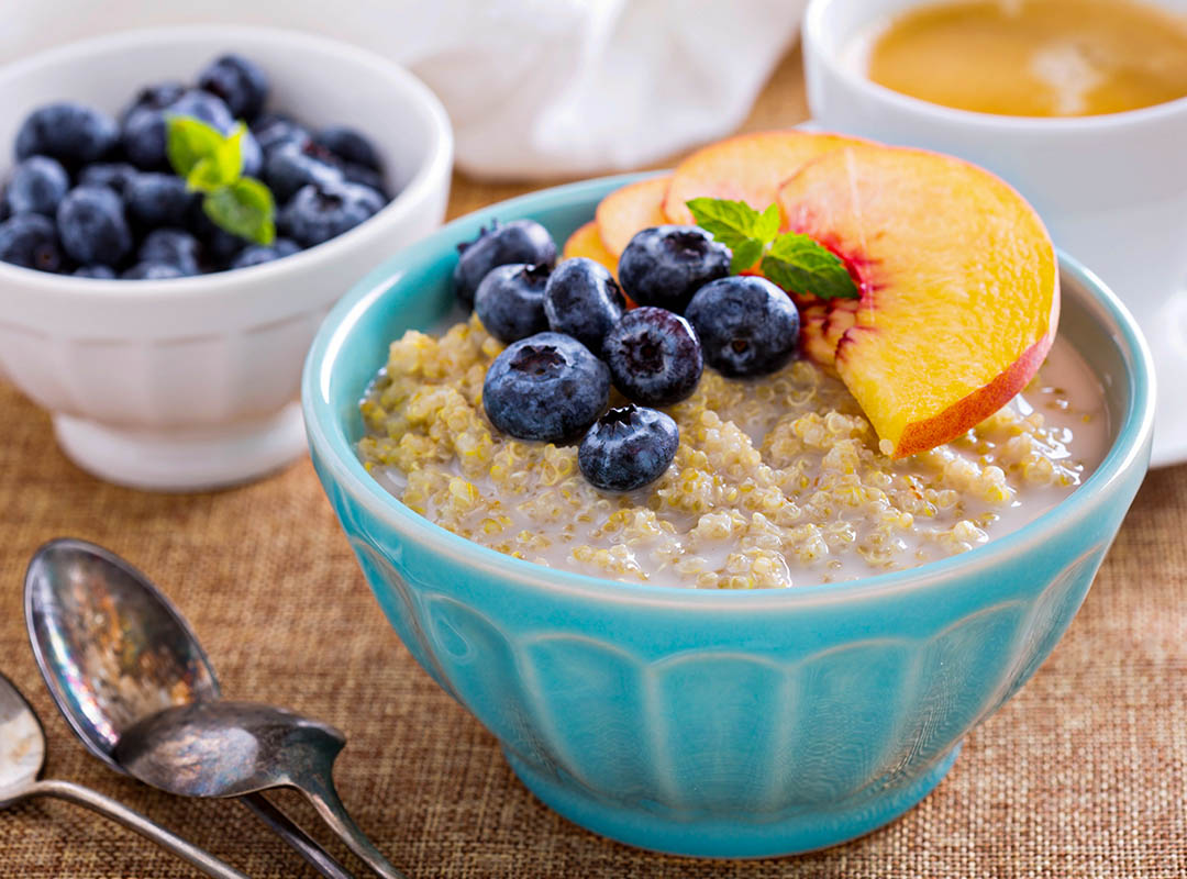 Peach, Blueberry and Apple Custard Porridge with Pepitas and Quinoa